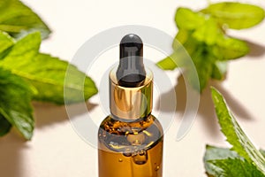 bottle of essential mint oil, natural skin care cosmetics