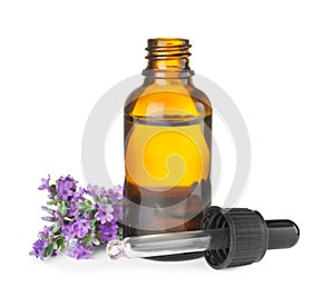 Bottle of essential oil and  flowers isolated on white