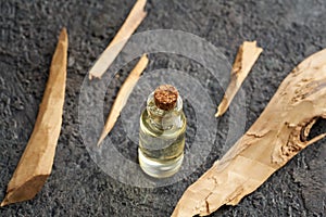 A bottle of essential oil with white sandalwood