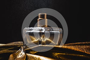 Bottle of wet perfume