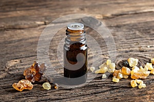 A bottle of frankincense essential oil with frankincense resin