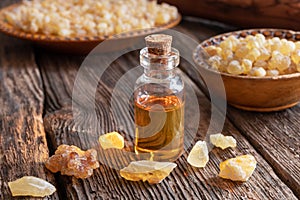 A bottle of frankincense essential oil with frankincense resin o