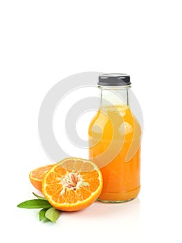 Bottle of fresh orange juice and sweet orange on white