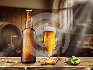 Bottle and glass of chilled beer, beer cask and blurred retro style bar at the background