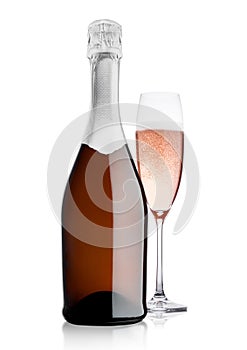 Bottle and glass of pink rose champagne on white