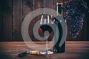 Bottle and glass of red wine, grape and cork