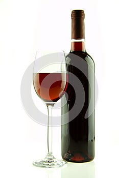 Bottle and glass of red wine isolated