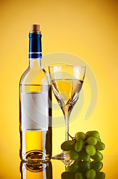 Bottle and glass of wine, grape bunch