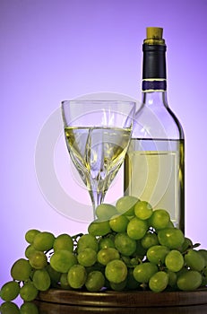 Bottle and glass of wine, grape bunch