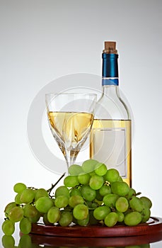 Bottle and glass of wine, grape bunch