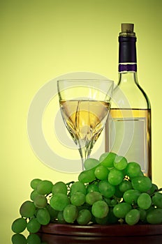 Bottle and glass of wine, grape bunch