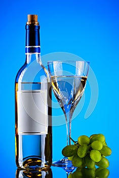 Bottle and glass of wine, grape bunch