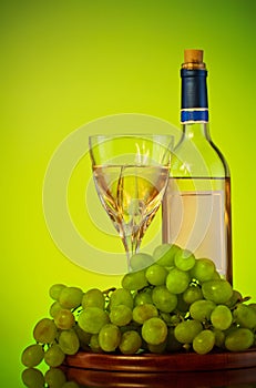 Bottle and glass of wine, grape bunch