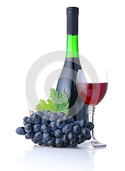Bottle and goblet of red wine with grapes isolated
