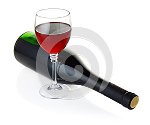 Bottle and goblet of red wine isolated on white