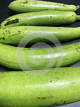 bottle gourd, Lagenaria siceraria isolated on black background.