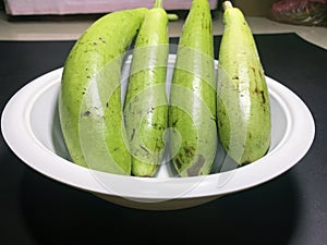 bottle gourd, Lagenaria siceraria isolated on black background.