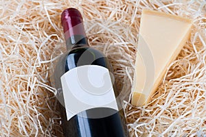 Bottle of great wine with wineglass and cheese