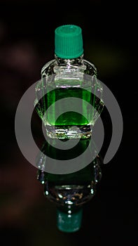 Bottle of Green Liquid