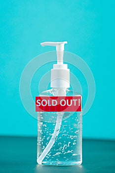 Bottle of hand sanitizer, hand desinfection gel and red label with Sold Out text. Symbol of coronavirus panic