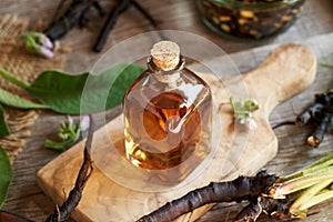 Comfrey root tincture in a glass bottle
