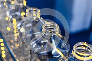 Bottle. Industrial production of plastic pet bottles. Factory line for manufacturing polyethylene bottles. Transparent food packag
