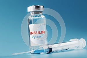 A bottle of insulin hormone and a syringe on the table