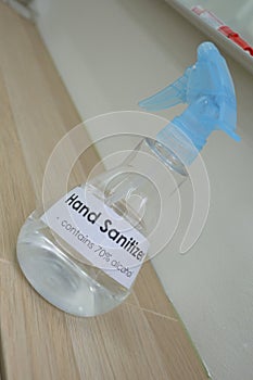 A bottle of labelled label labels hand sanitizer cleaner spray on display