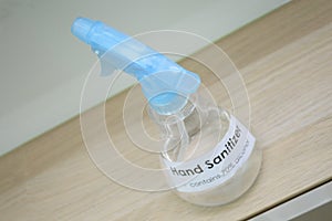 A bottle of labelled label labels hand sanitizer cleaner spray on display