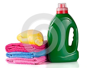 Bottle laundry detergent and conditioner or fabric softener with towels isolated on white background