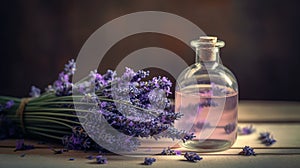 a bottle of lavender oil next to a bunch of lavender flowers on a table top with a corked corker on the top of the bottle