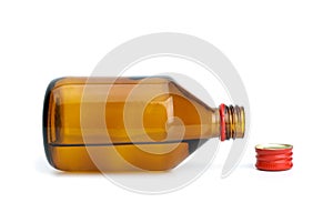 Bottle with liquid and cap near