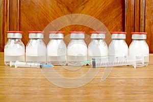 Bottle of liquid medicine on a wooden table