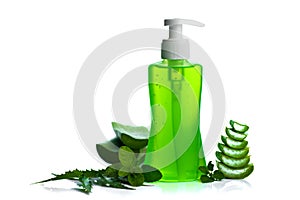 Bottle of liquid soap or cream or face wash dispensers with aloe vera, neem and basil leaf isolated on white background