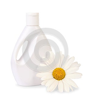 Bottle of liquid soap with daisy flower on white