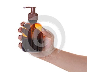 Bottle with liquid soap in hand