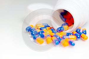 Bottle of medical pills or capsules isolated over white