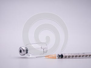 Bottle of medicine and syringe