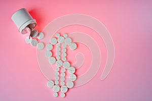 Bottle with medicines lies on a pink background. Pharmacy business, medicine pill concept.Close up and top view