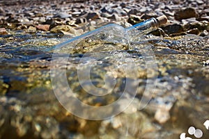 Bottle with a message in water