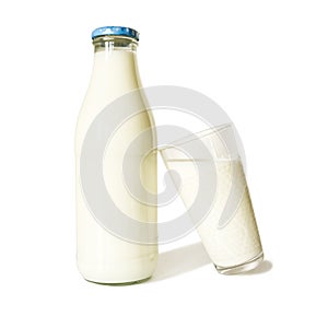 Bottle Of Milk With Blue Lid And Milk Glass - On White Background