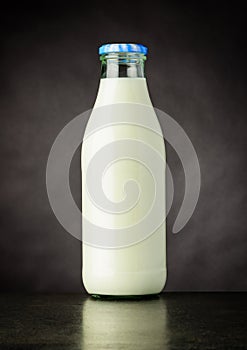 Bottle Milk on Dark Background