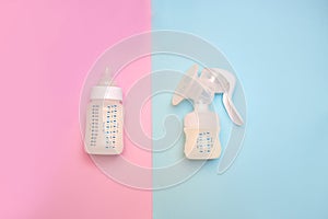 Bottle of milk for a newborn on a pink background