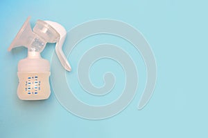 Bottle of milk for a newborn on a pink background