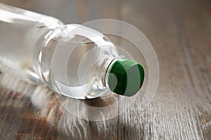 Bottle of mineral water on a wooden background