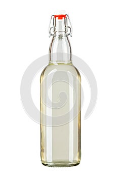 Bottle of moonshine or vodka infused with sea buckthorn isolated on white background. Alcoholic drink
