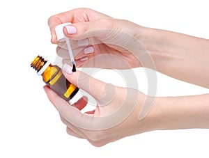 Bottle Nail Oil Cuticle in hand photo