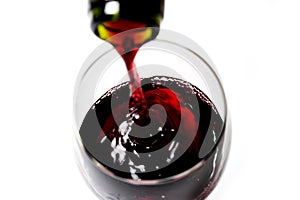 Bottle neck close up filling Glass with Red Wine