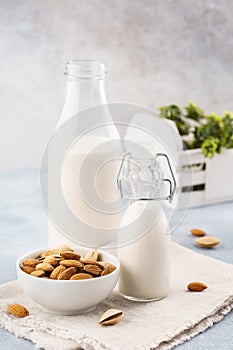 Bottle of nut milk and raw almonds. Alternative milk