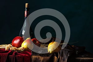 A bottle of old wine and ripe fruit on a dark background, Dutch still life.